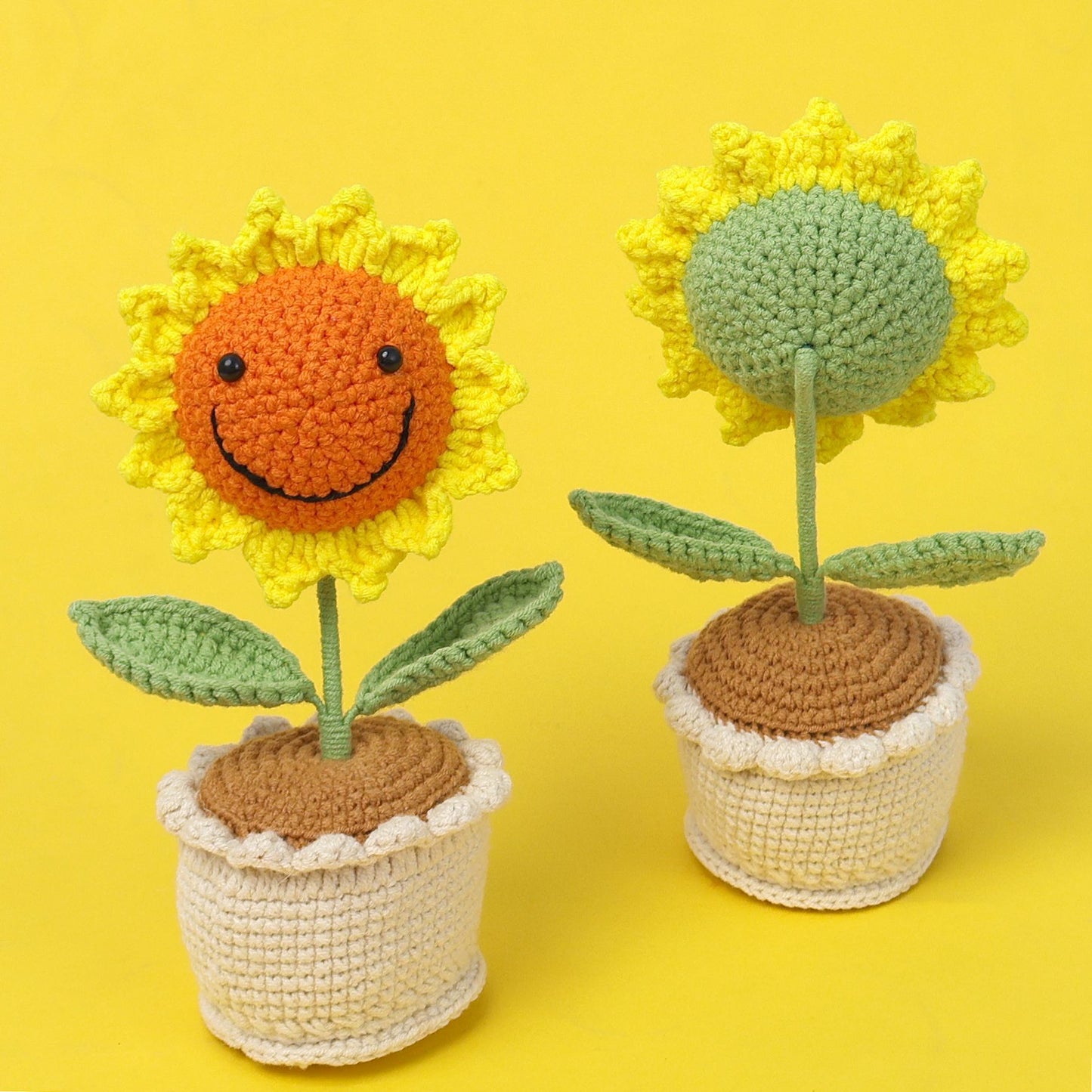 Handmade crocheted sunflower potted plant with smiling face