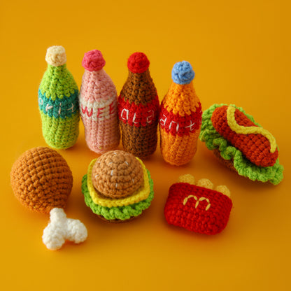 Crocheted meal pendant, small hamburger, chicken legs, French fries, and cola