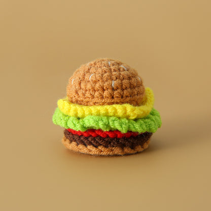 Crocheted meal pendant, small hamburger, chicken legs, French fries, and cola