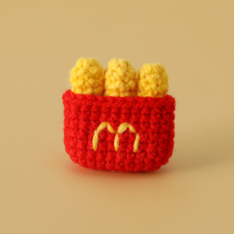 Crocheted meal pendant, small hamburger, chicken legs, French fries, and cola